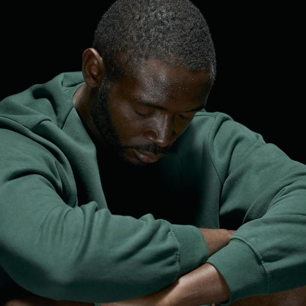 Close-up of a person meditating with a serene expression.